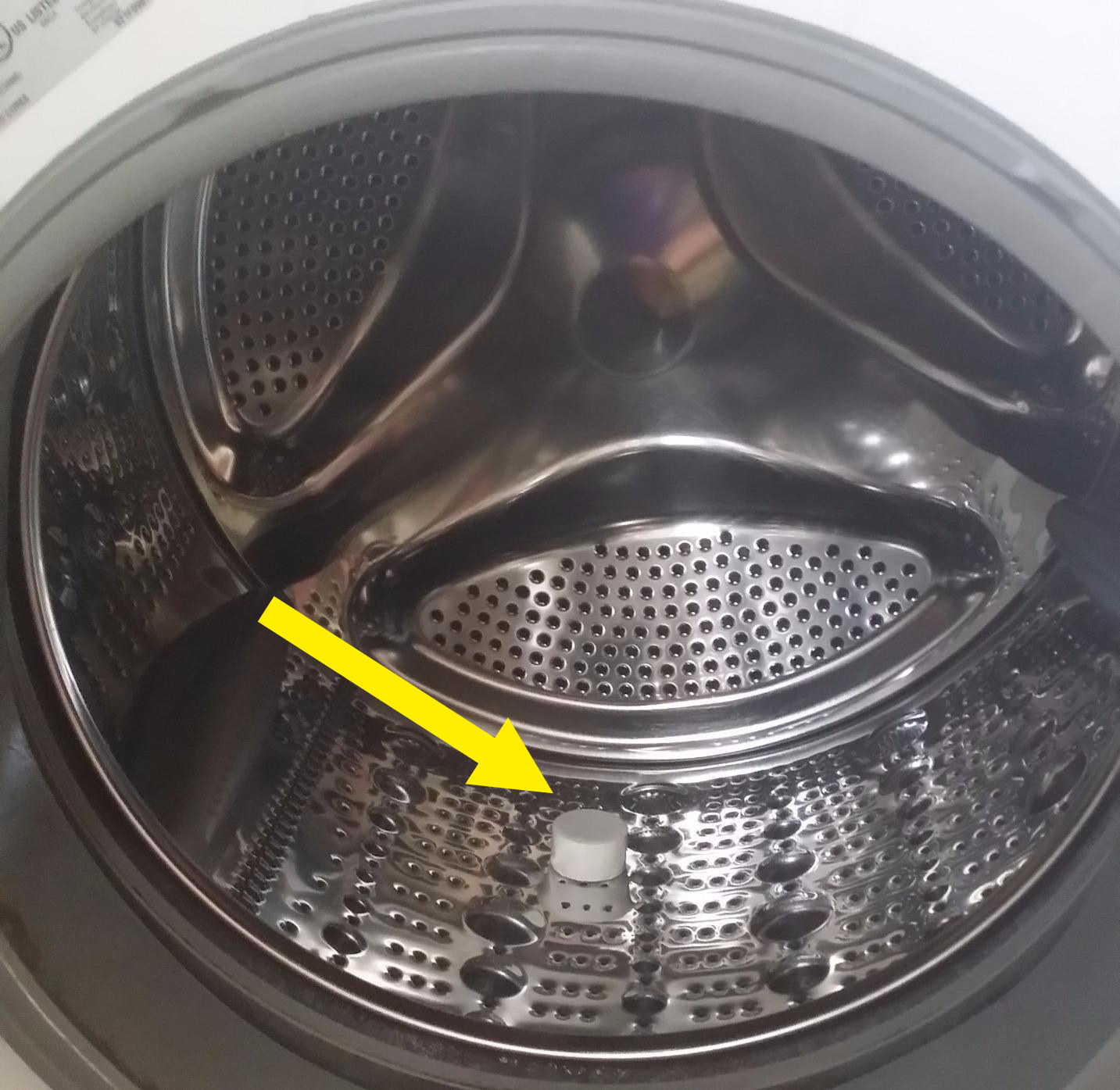 the washing machine cleaner tablet inside silver drum area of washer