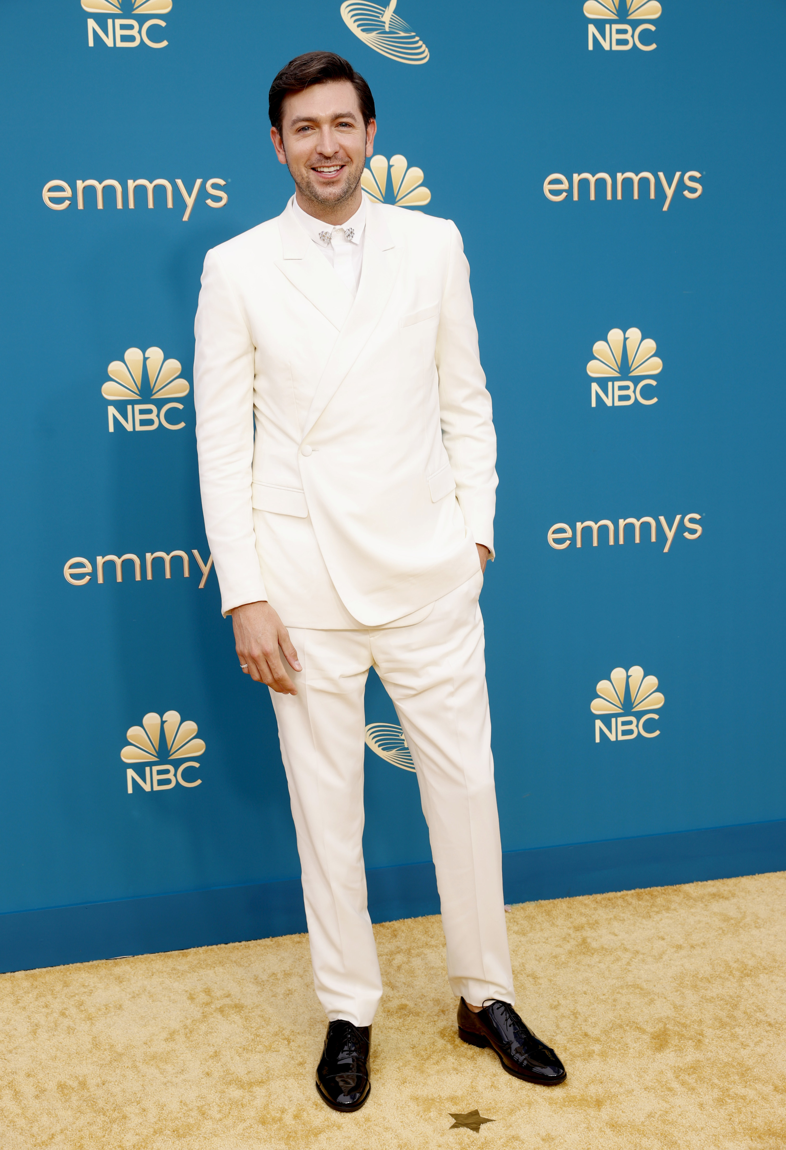 wearing an all-white suit