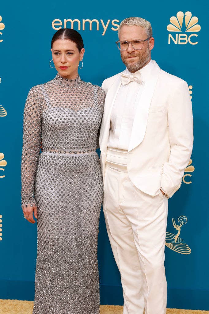 Lauren Miller in a silver sequined gown and Seth Rogen in a white tux