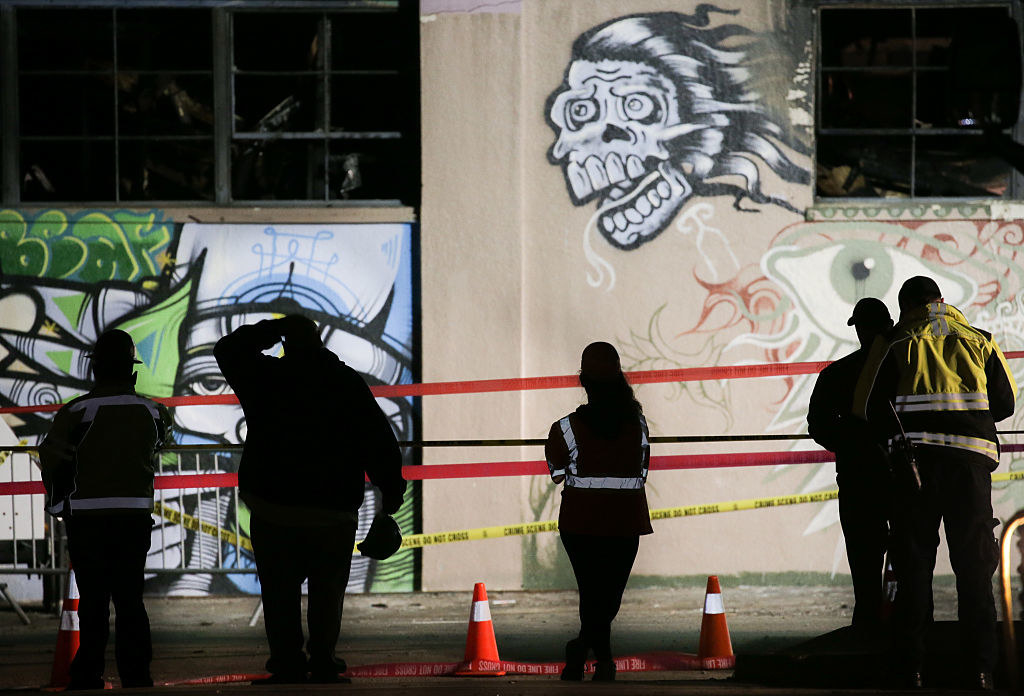 emergency response services outside warehouse in oakland that burned