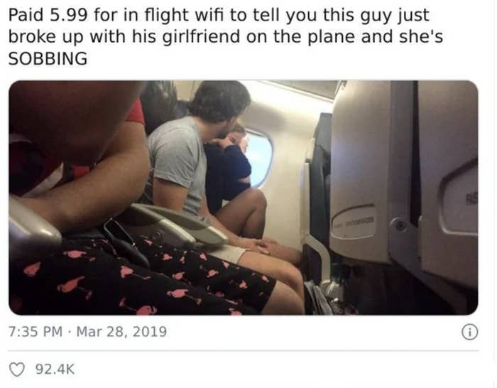 A man breaking up with his girlfriend on a plane