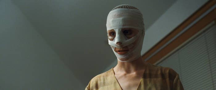 A woman with bandages all over her face
