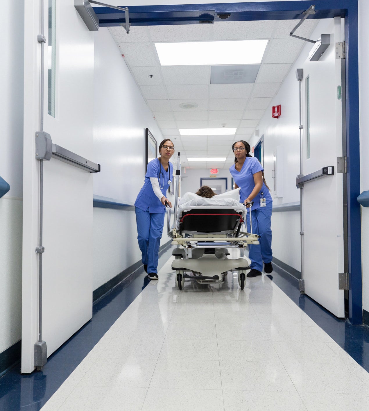 nurses taking a patient to the operating room