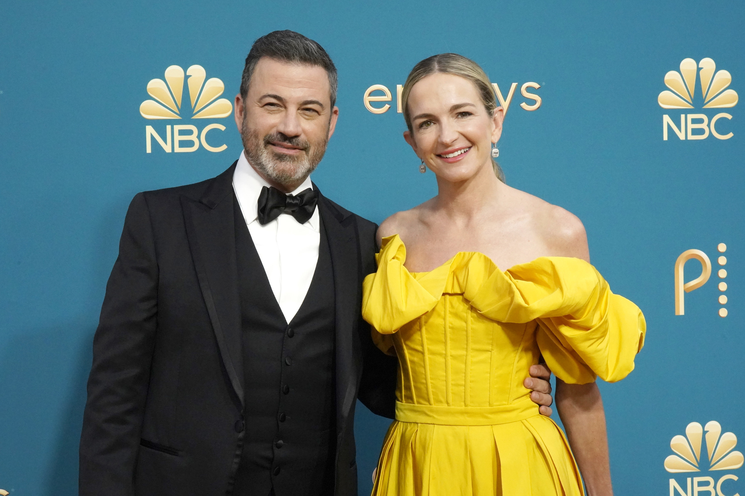 Jimmy Kimmel in a black tux and Molly McNearney in a yellow strapless gown