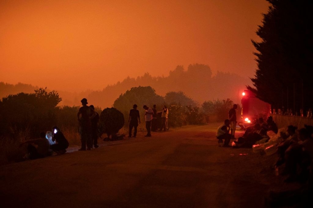 evia, greece with orange skies from fire