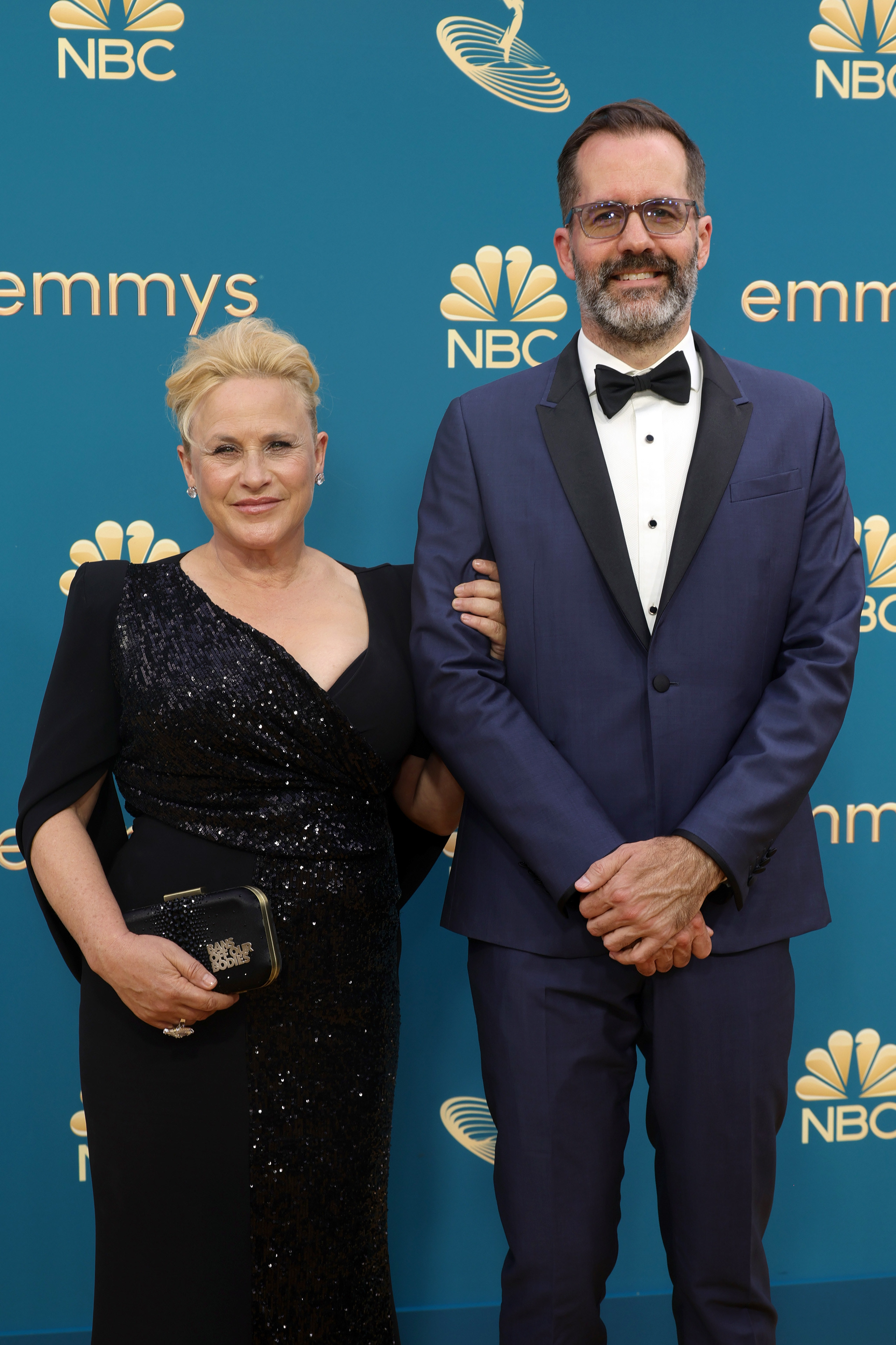 Patricia Arquette in a black sequined dress and Eric White in a black and blue tux