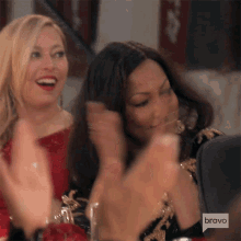 sutton stracke and garcelle beauvais clapping