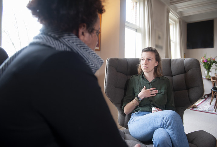 a woman sitting in therapy