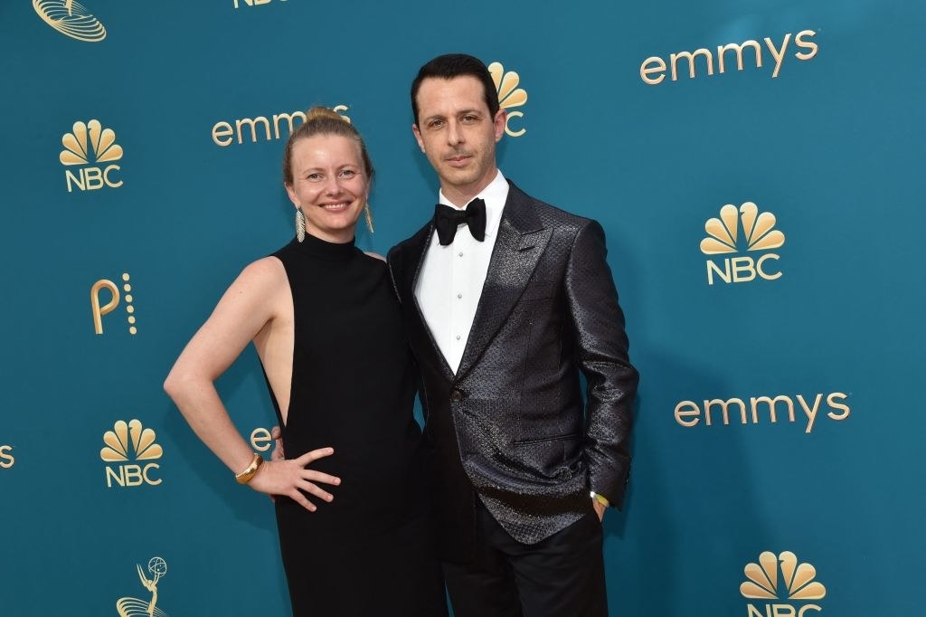 Emma Wall in a black gown and Jeremy Strong in a shiny black tux