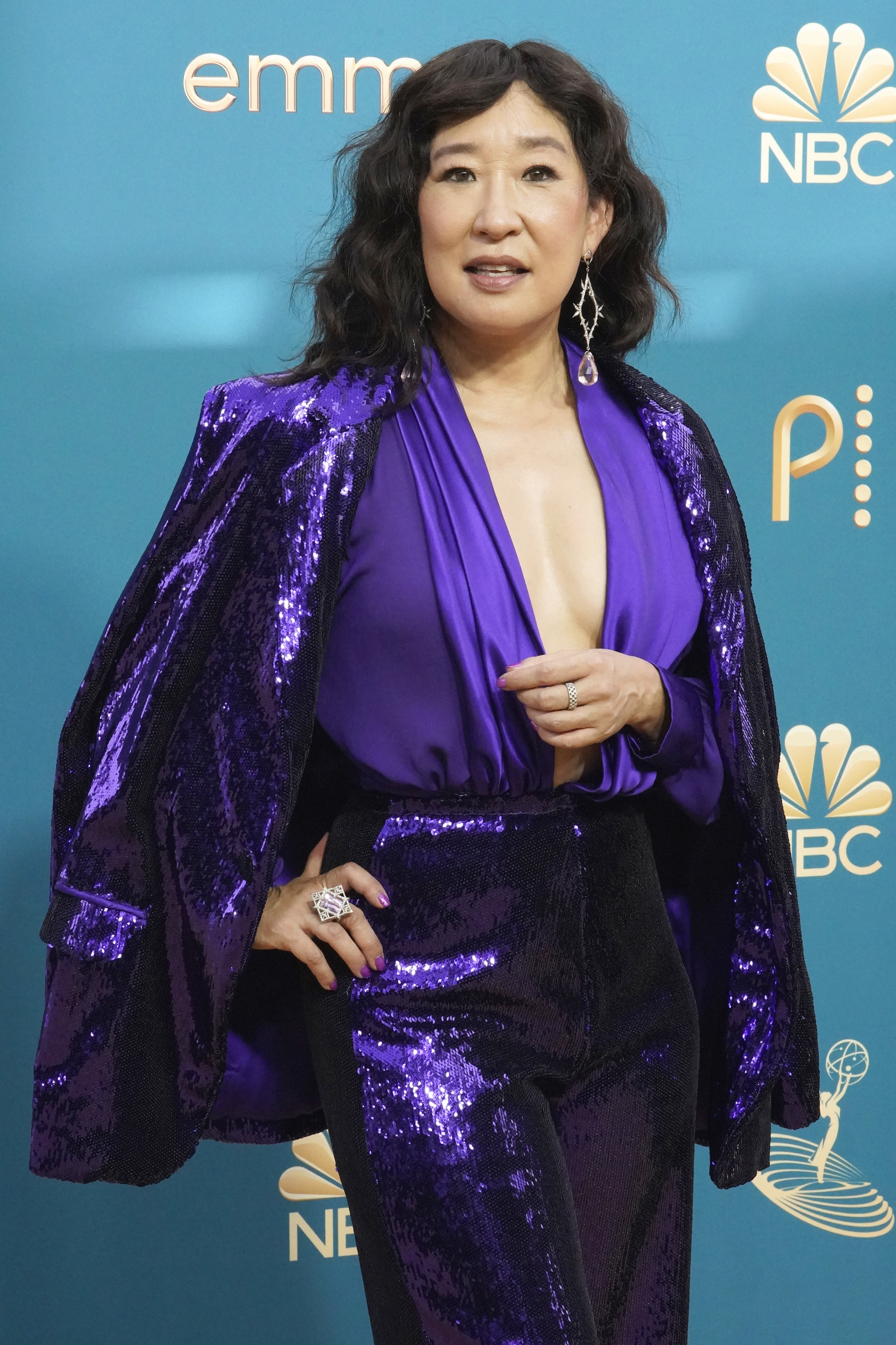 closeup of Sandra Oh in a shiny blue suit