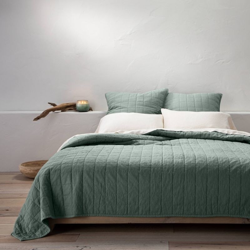 the quilt in the sage green color