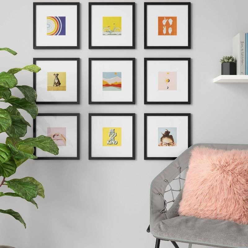 the frames hung in a grid on the wall