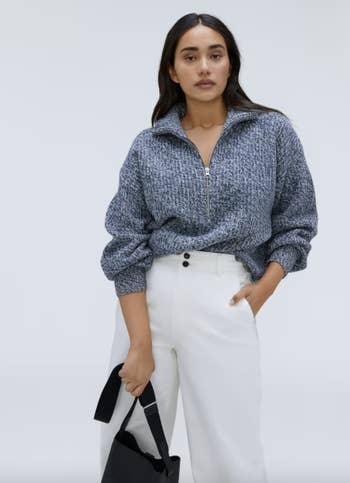different model wearing the sweater in heathered blue