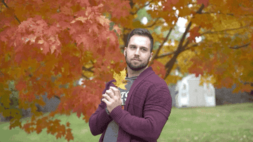 a gif of trey kennedy holding up a maple leaf and saying orange you glad it&#x27;s fall?
