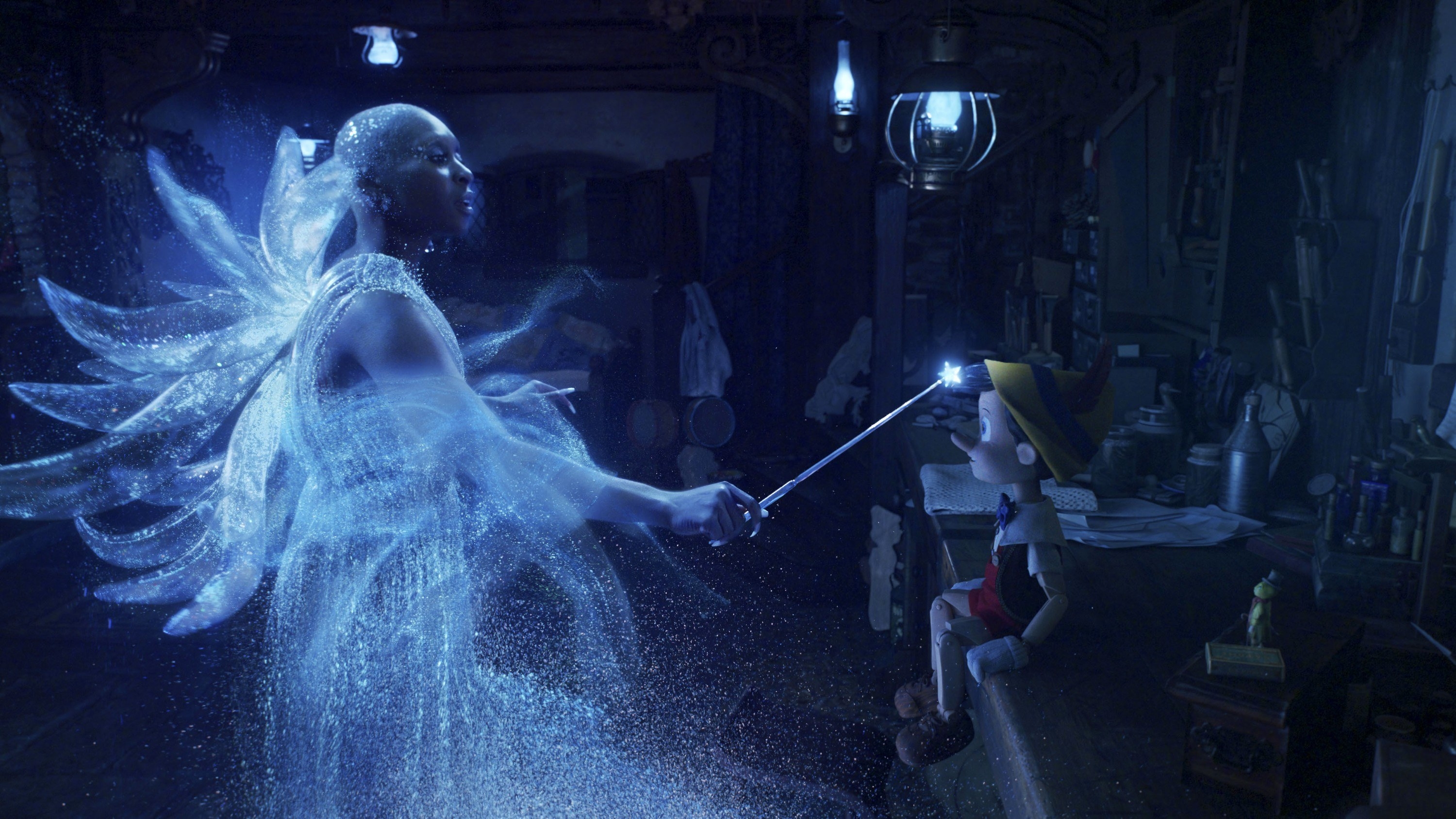 A blue fairy blesses a wooden puppet with life