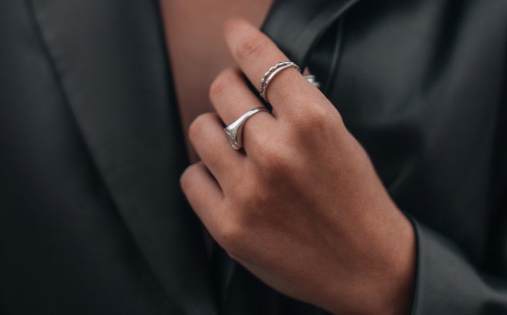 Closeup of a woman&#x27;s hand wearing rings