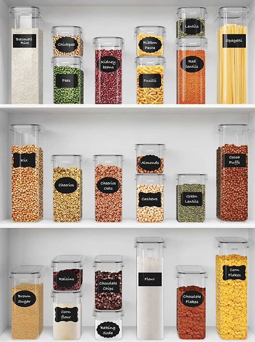 several food storage containers on shelves containing pantry ingredients