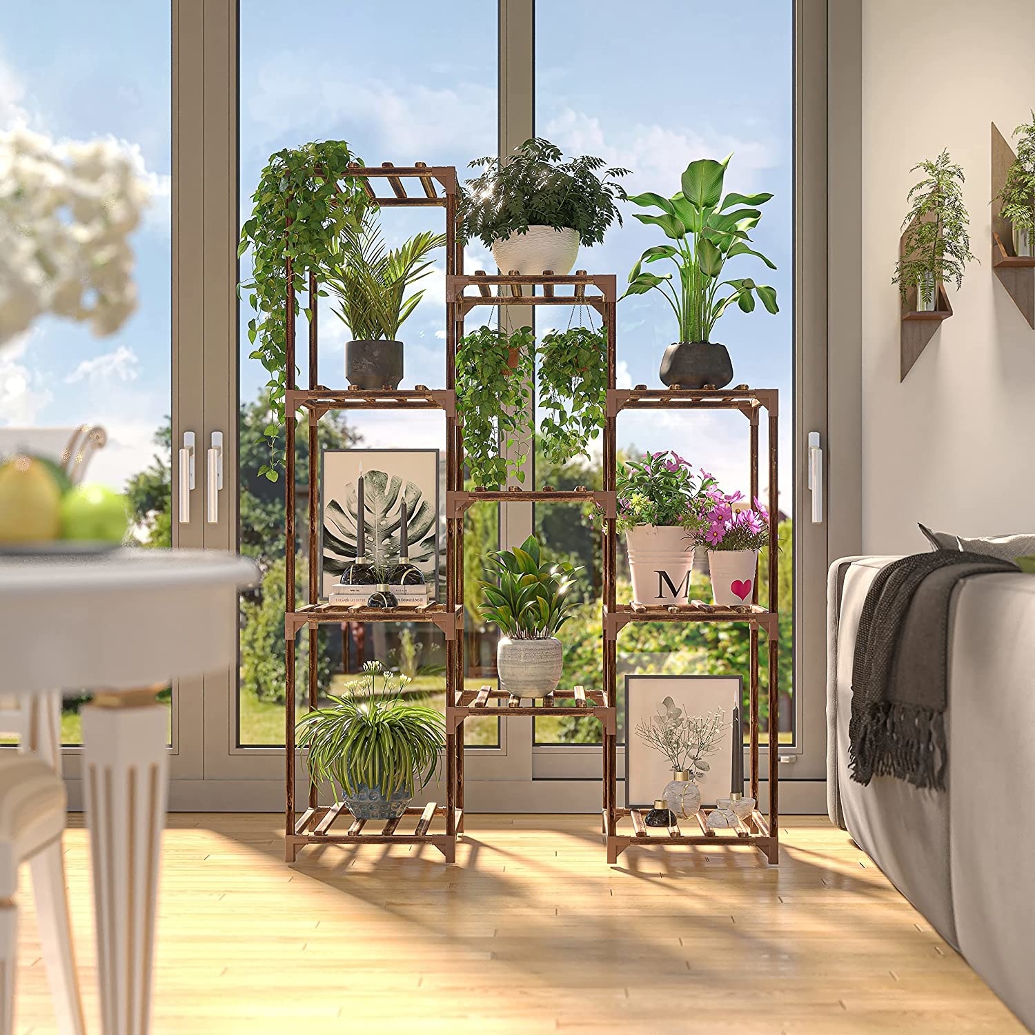 a large shelf in front of a sunny mirror with plants on it