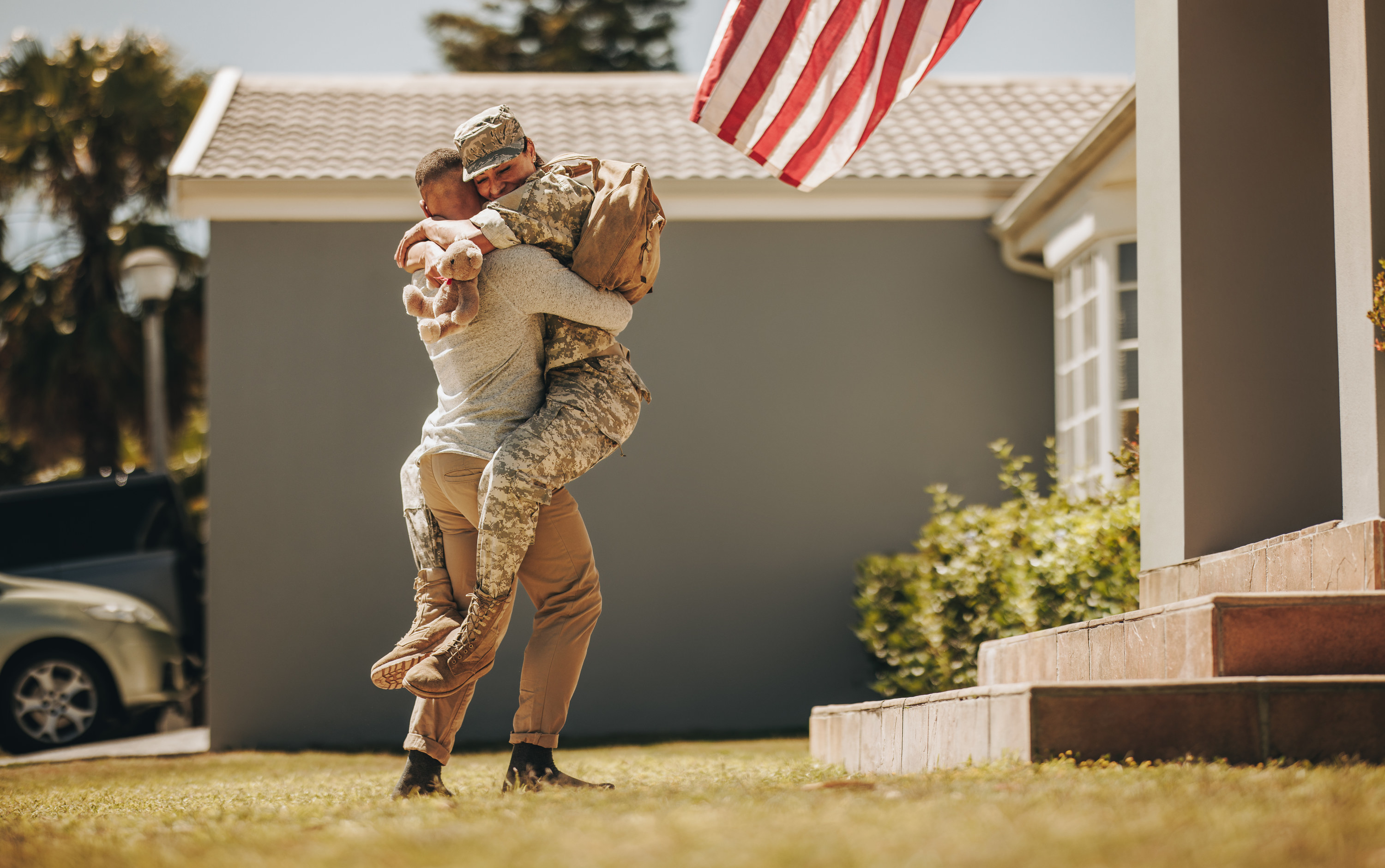 Soldier and wife embrace