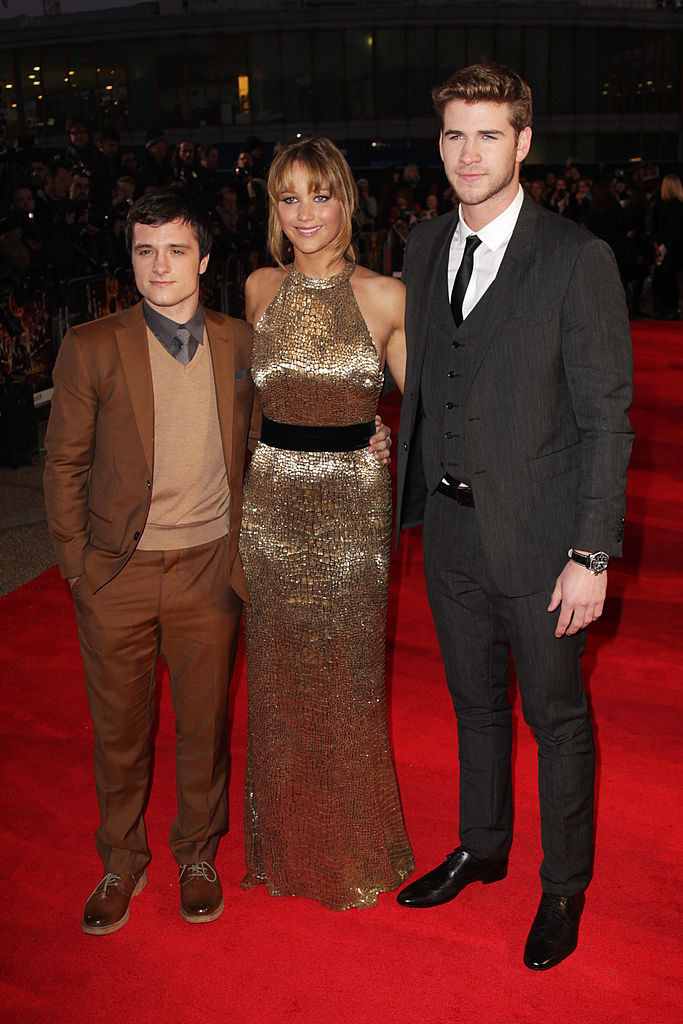 Josh Hutcherson, Jennifer Lawrence, and Liam Hemsworth on the red carpet