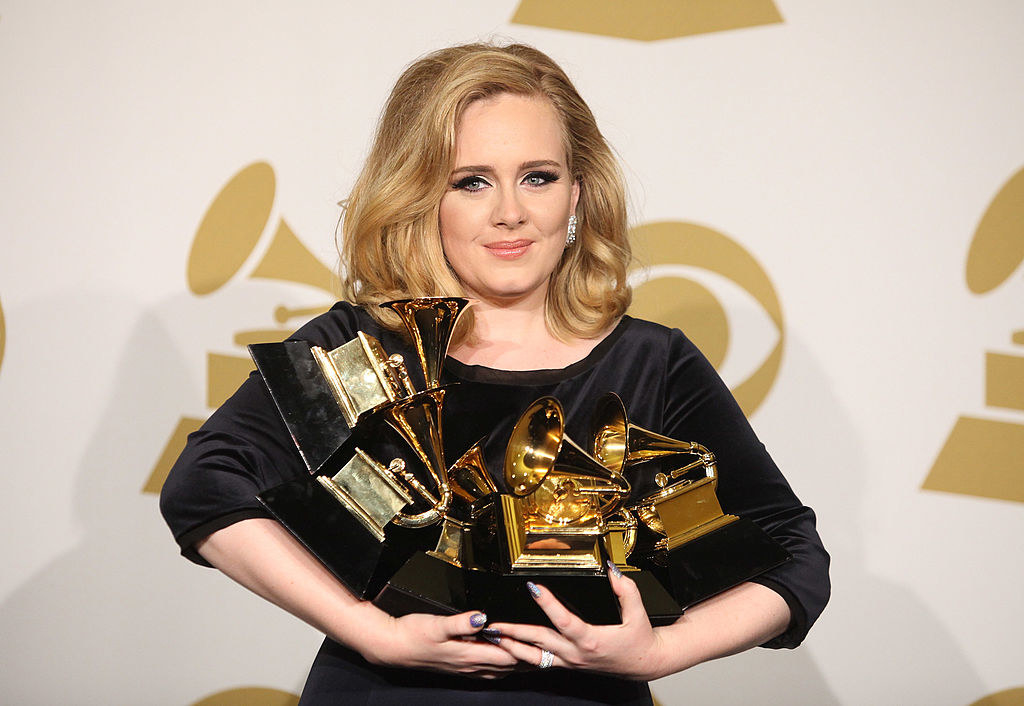 Adele holding her Grammys