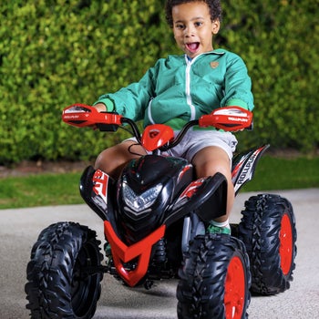 A child model riding the red and black ATV