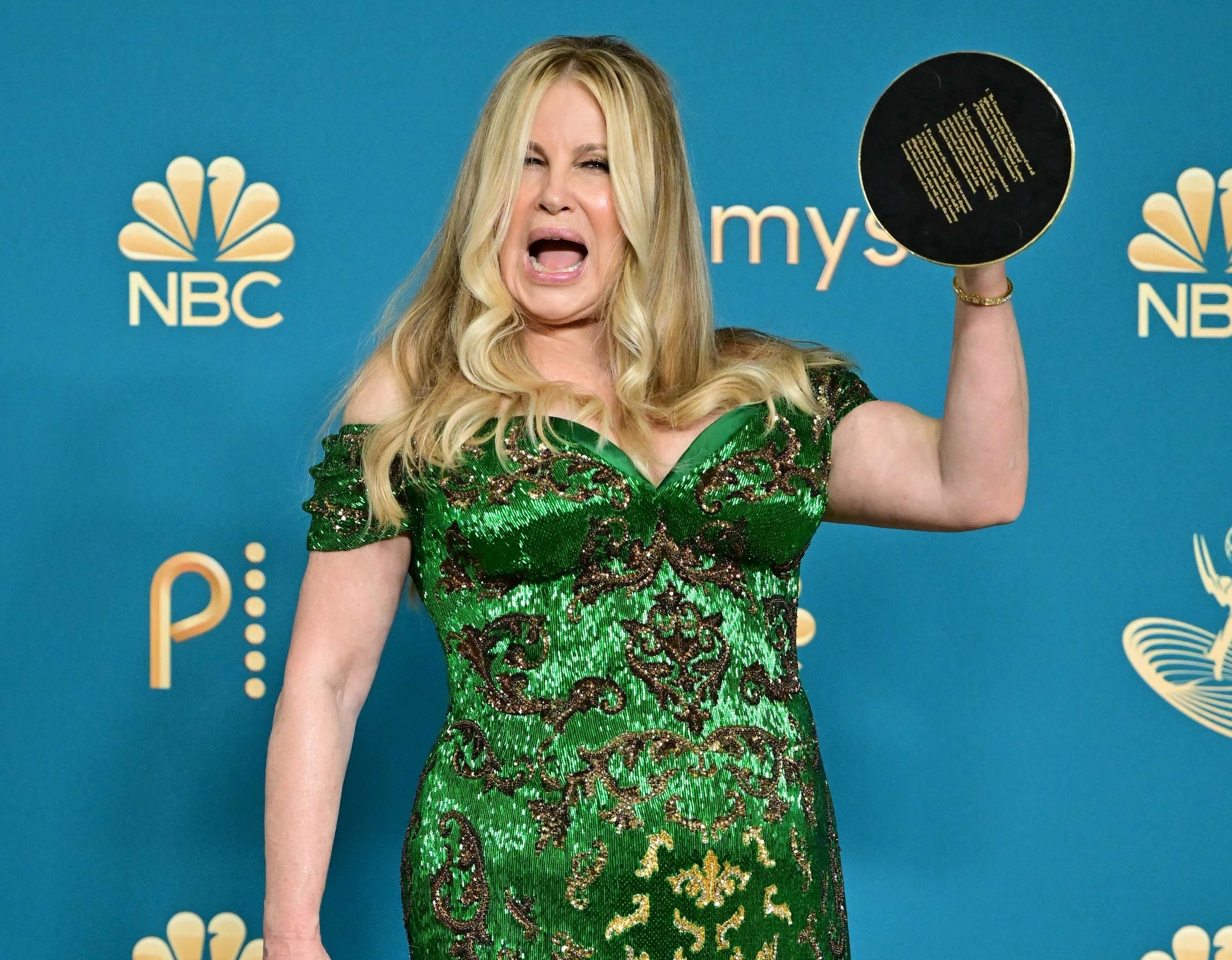Jennifer holds up her award backstage
