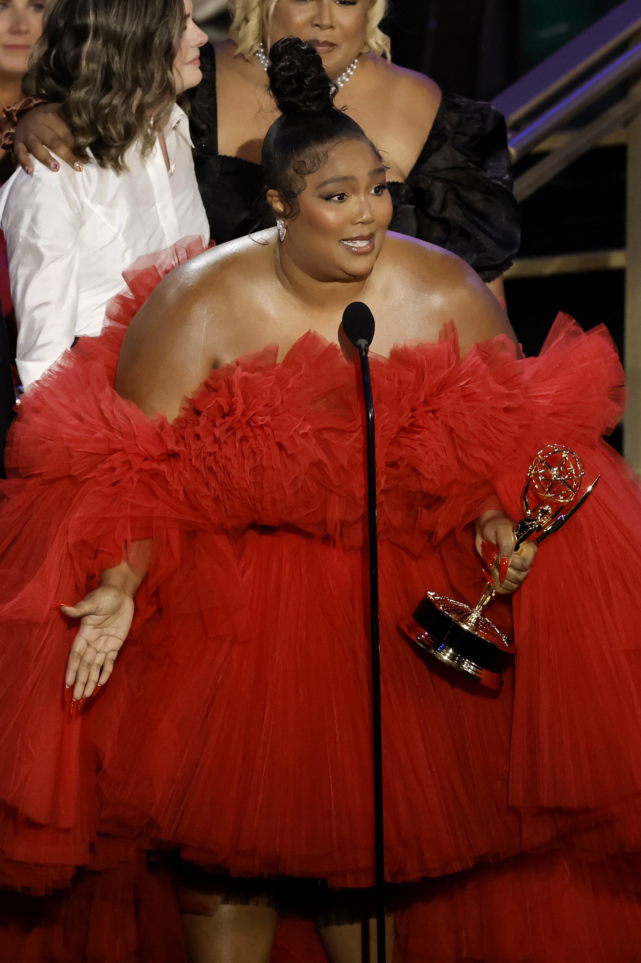 Lizzo accepting an Emmy