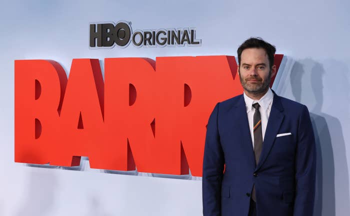 Bill Hader standing in front of a sign for &quot;Barry&quot;
