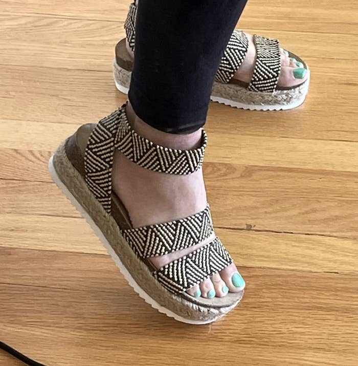 reviewer wearing the shoes with a geometric pattern