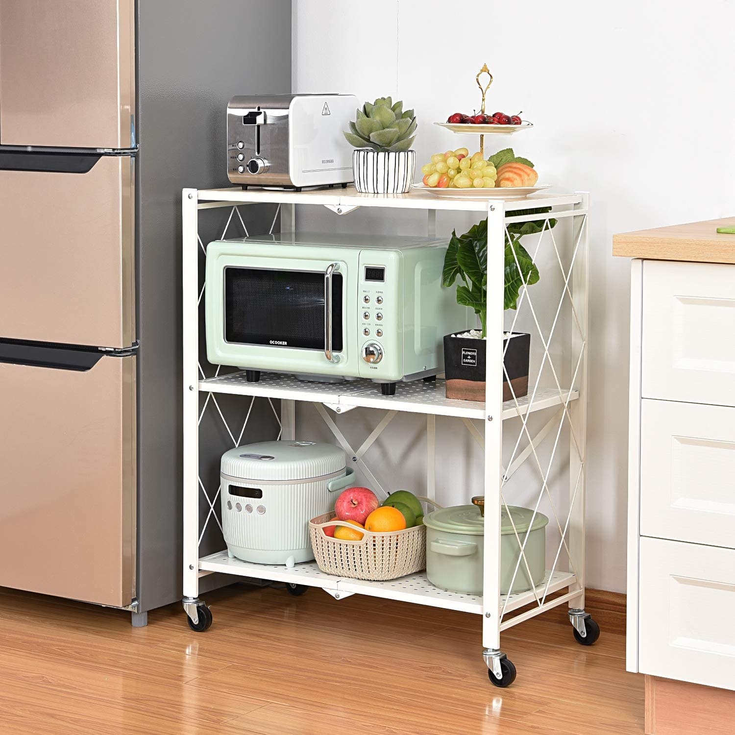 the fold-out rolling rack filled with small kitchen appliances and decorative items