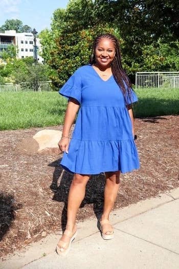a reviewer in the blue dress