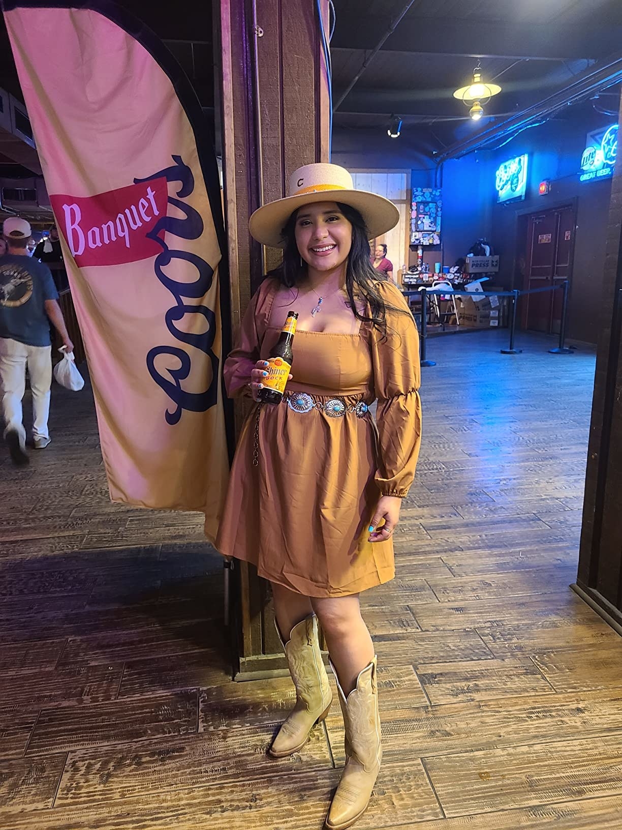 another reviewer wearing the dress in tan