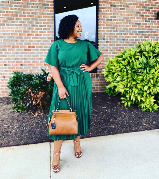 Reviewer in green tie waisted short sleeved pleated midi skirt dress 