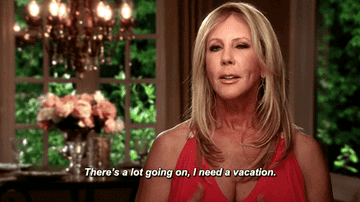 A GIF from Real Housewives of a lady saying &quot;There&#x27;s a lot going on, I need a vacation&quot;