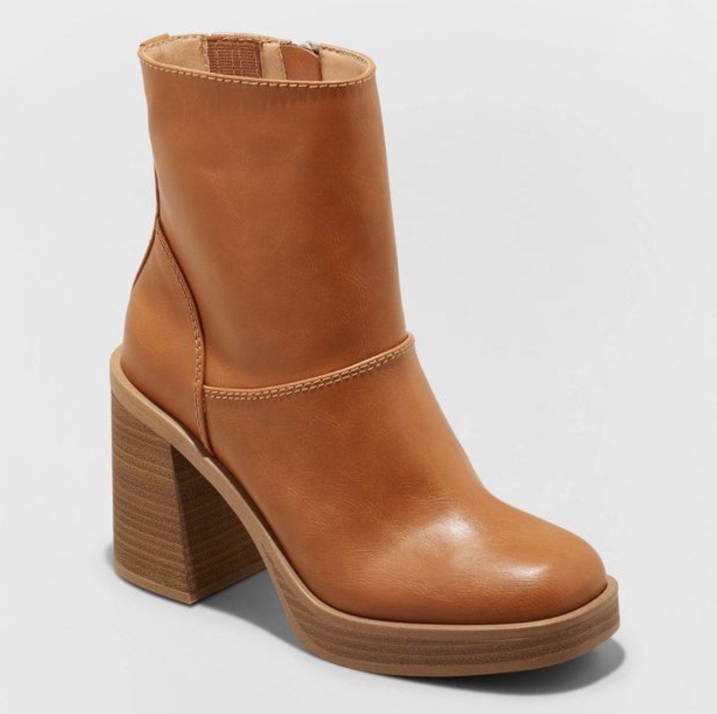 The brown leather platforms have thick textured soles