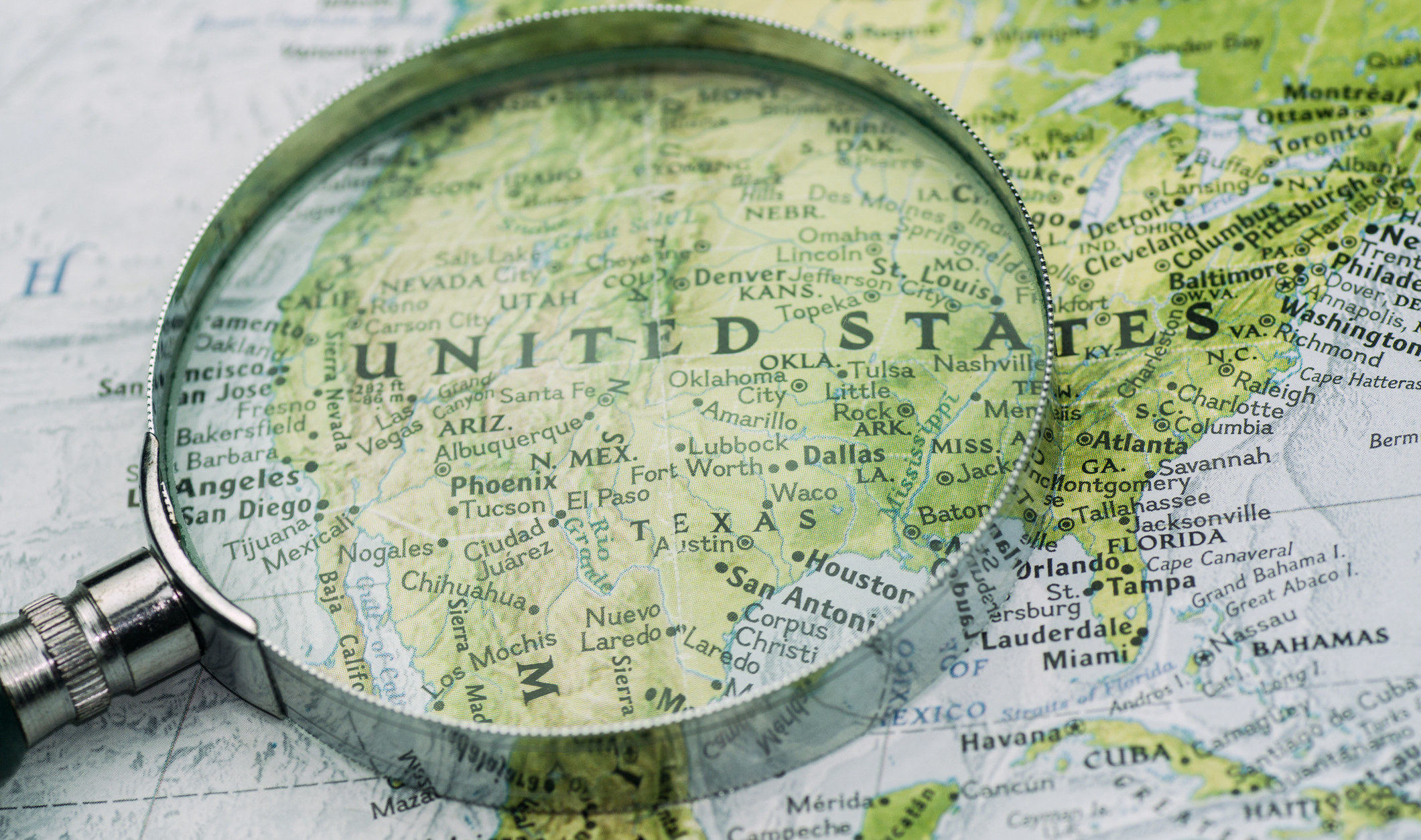 A shot of a magnifier glass over map of united states