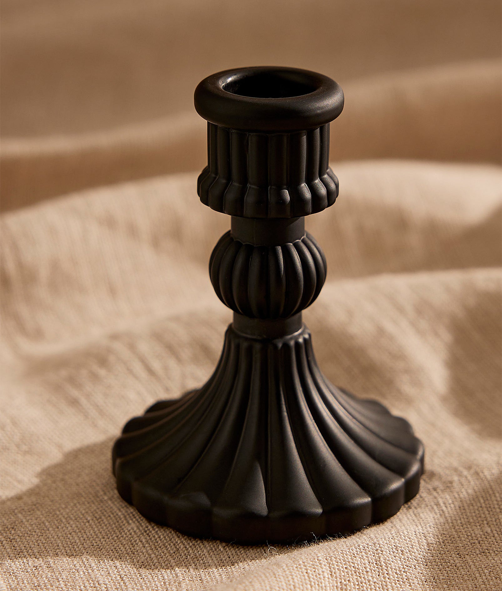 an elegant black candle holder