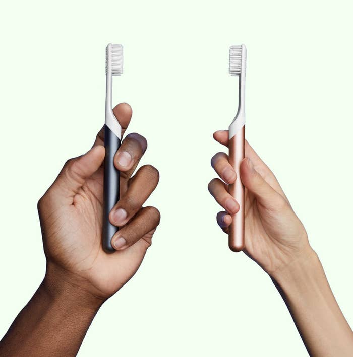 models holding the toothbrushes in their hands