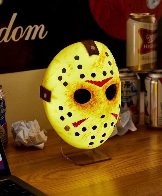 a light-up jason mask on a desk