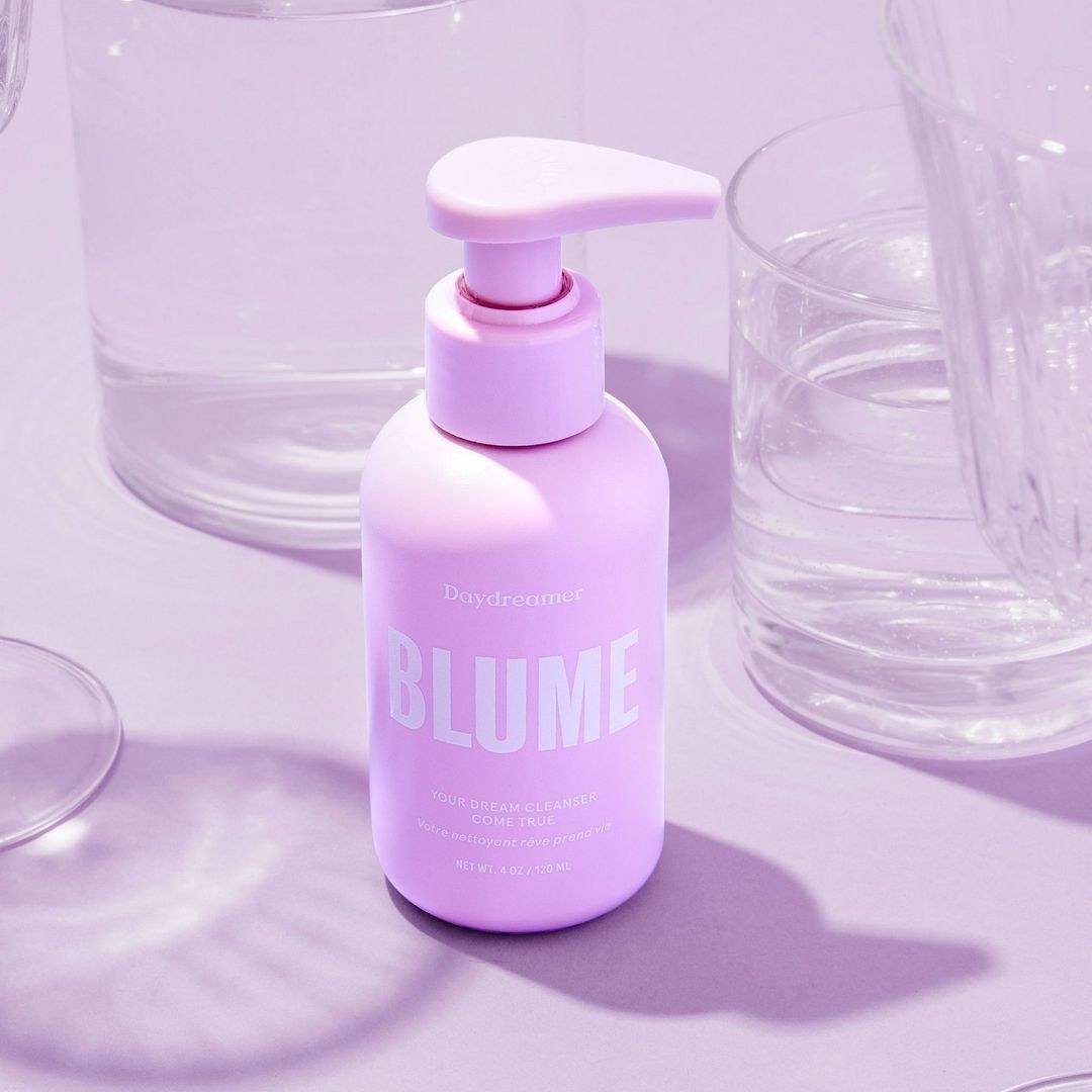 The bottle of cleanser surrounded by glasses