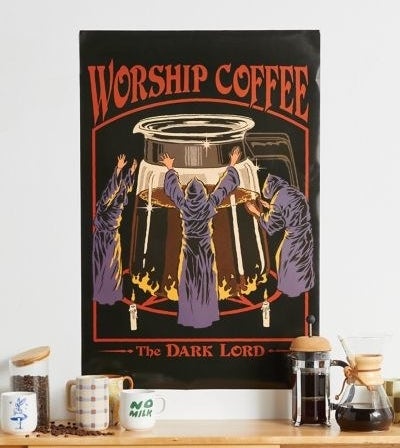 a poster that says worship coffee the dark lord with three people bowing to a pot of a coffee illustrated on it