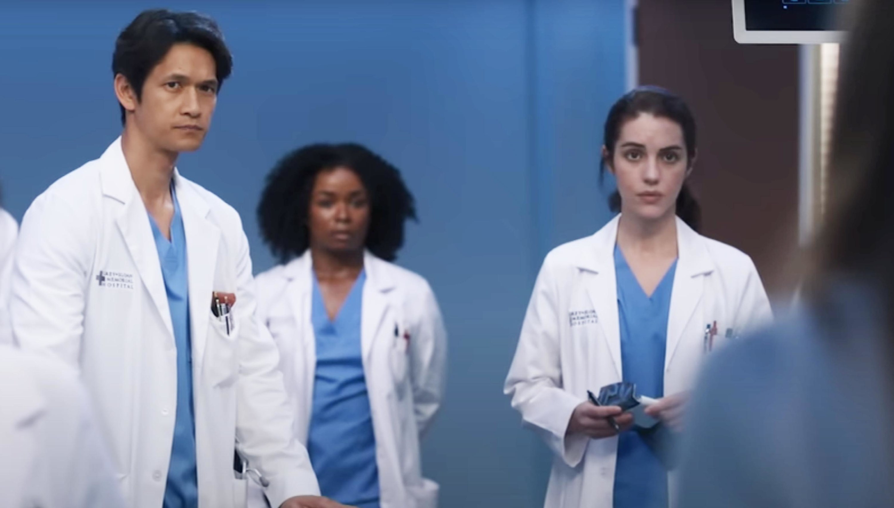 a group of medical professionals looking serious