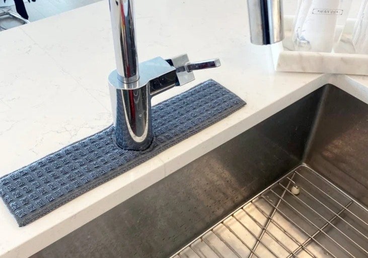 a faucet with a blue drip catcher around the base