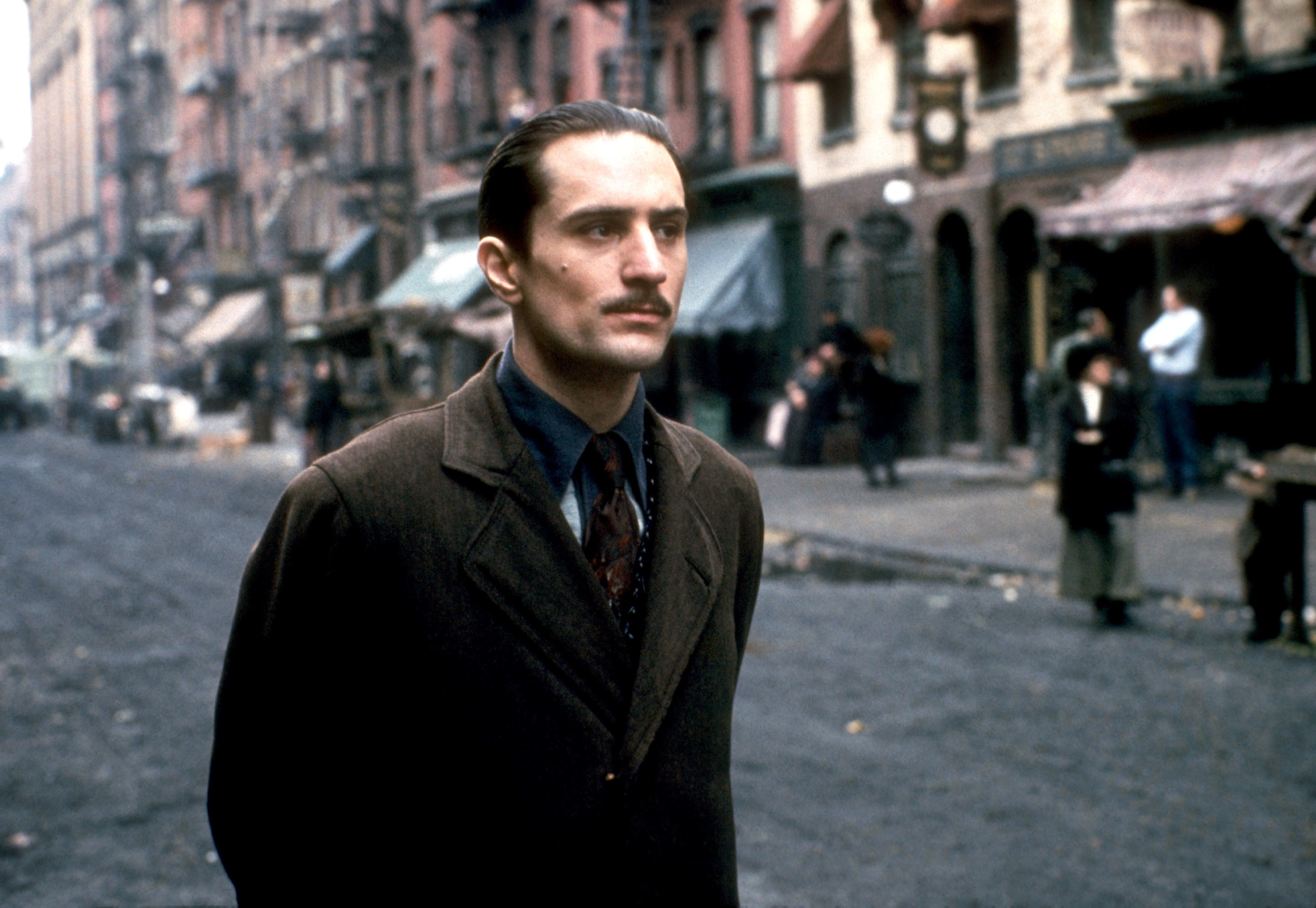 Robert on the streets of Little Italy with a thin mustache