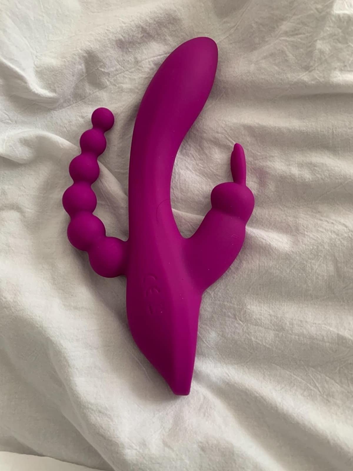 Pink vibrator with anal beads, clitoral ears and g-spot shaft