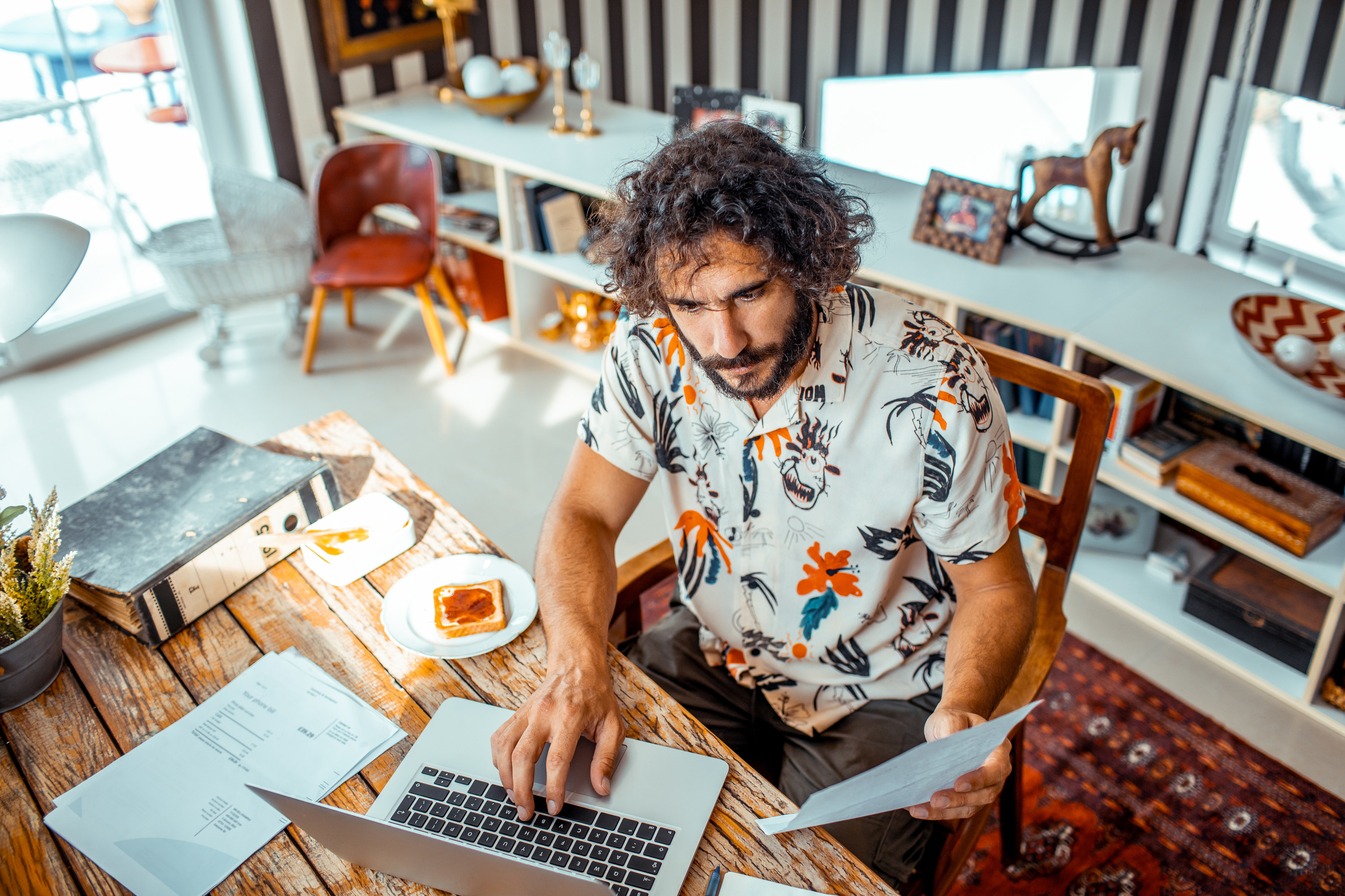 Man working on his laptop from home