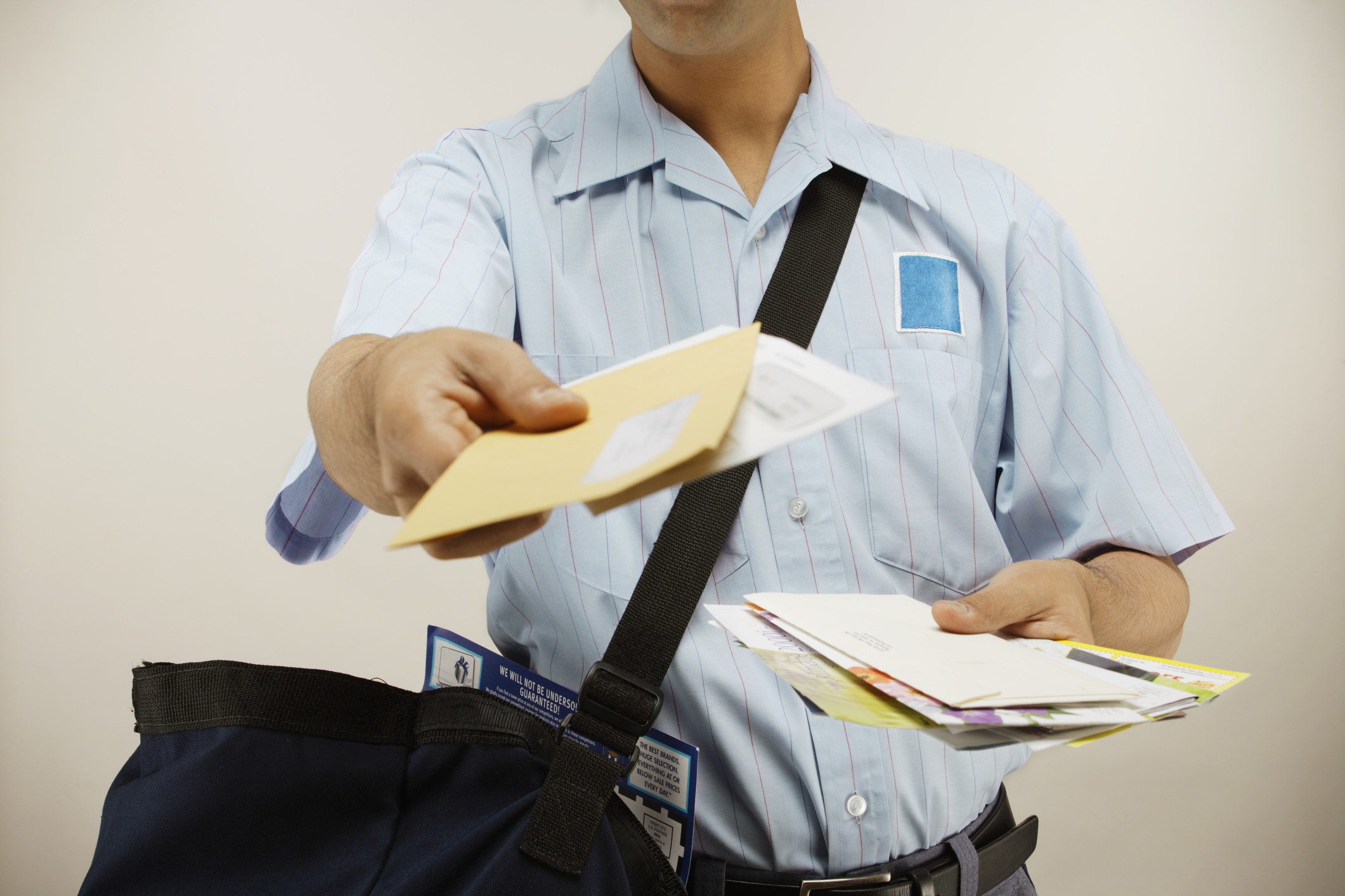 delivery man handing mail