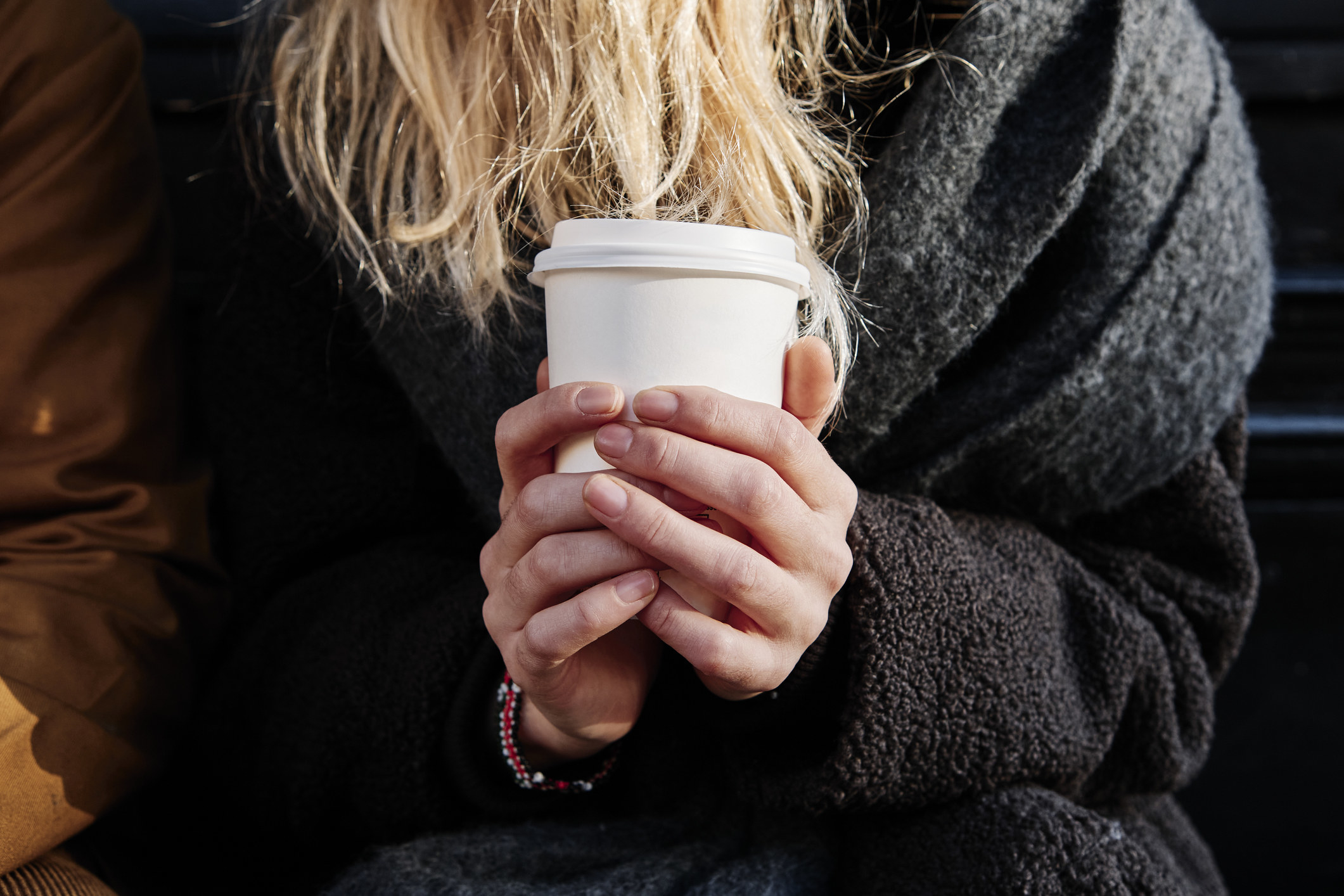 Person holding a cup of coffee