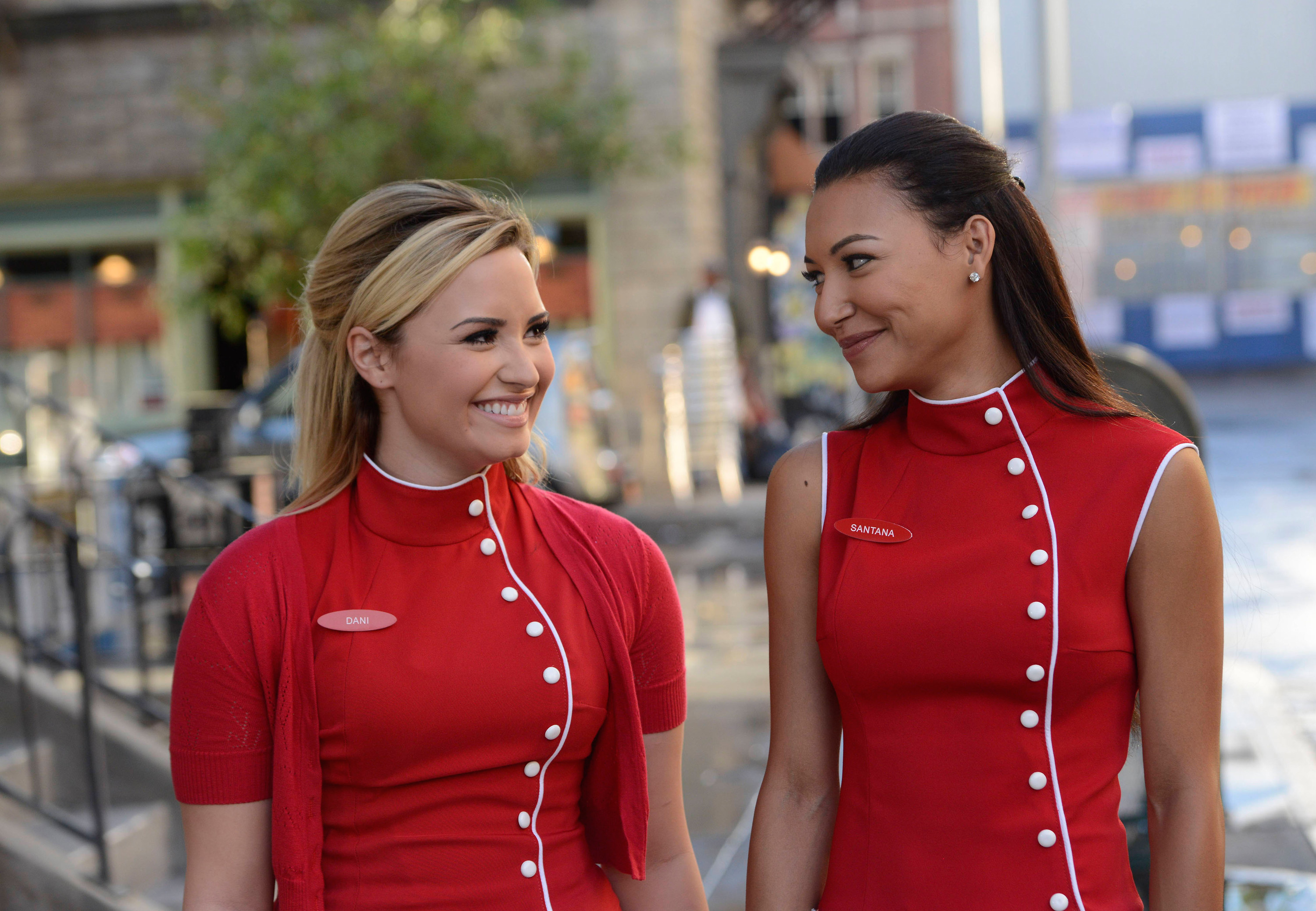 Dani and Santana smiling at each other